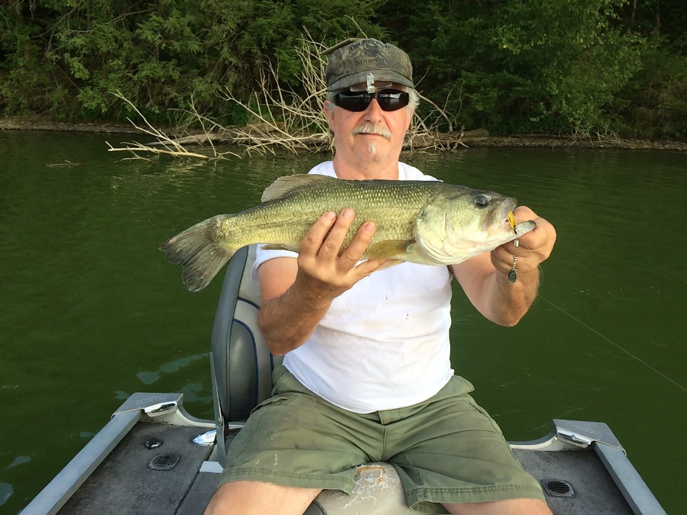 A 21-inch, 5 pound bass caught on a silver-yellow Timberwolf spinner.