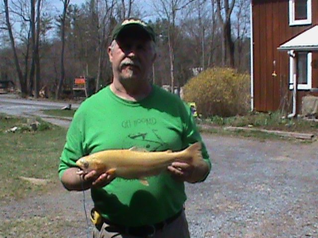 Golden rainbow at Poe Valley Lake on a gold pheasant tail
