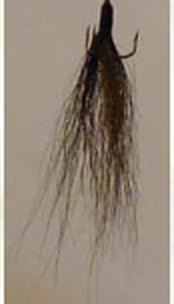 Long hand-tied Great Lakes goby pattern tail for a Timberwolf spinner.