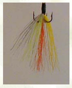 Custom Timberwolf spinner with a long yellow, orange, white and green tail.